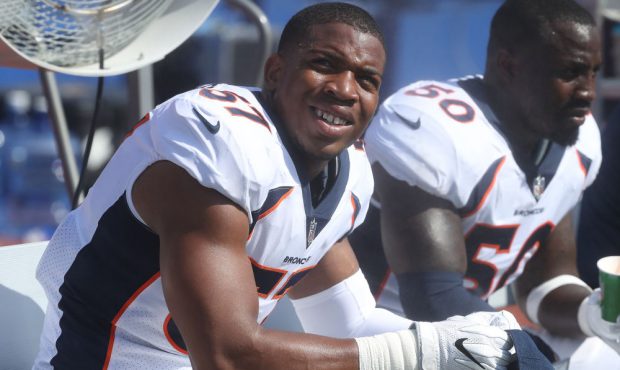 DeMarcus Walker (57) of the Denver Broncos looks on from the bench during NFL game action against t...
