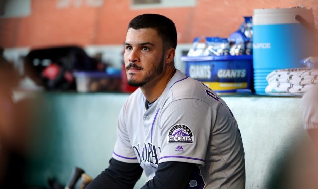 Nolan Arenado (28) of the Colorado Rockies looks on from the dugout during a game against the San F...
