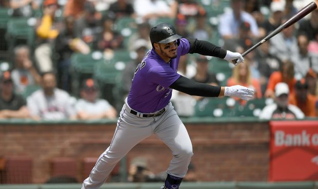 SAN FRANCISCO, CA - JUNE 28:  Nolan Arenado #28 of the Colorado Rockies hits a two-run RBI single a...