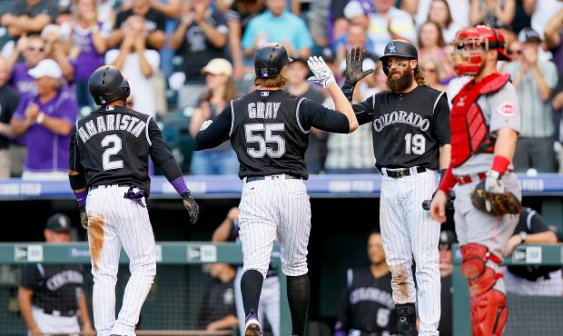 DENVER, CO - JULY 5:  Jon Gray #55 of the Colorado Rockies is congratulated by Alexi Amarista #2 an...