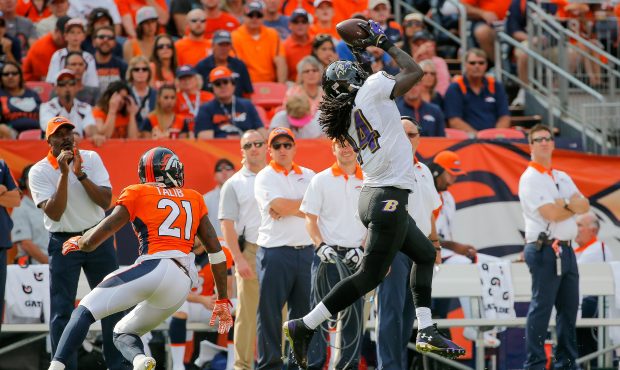 DENVER, CO - SEPTEMBER 13: Wide receiver Marlon Brown #14 of the Baltimore Ravens makes a catch und...