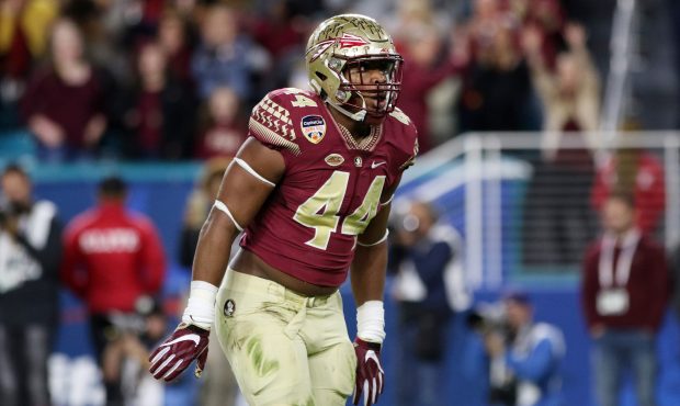 DeMarcus Walker #44 of the Florida State Seminoles reacts in the first half against the Michigan Wo...