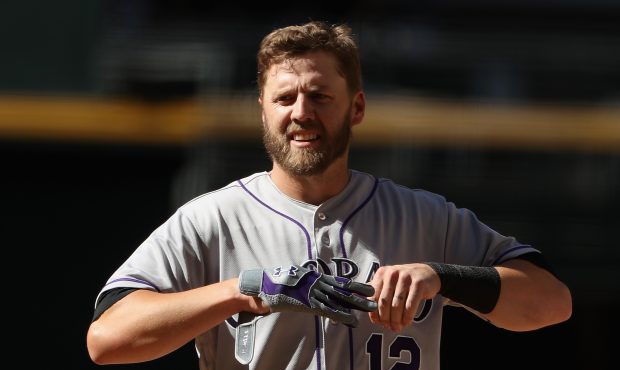 Mark Reynolds #12 of the Colorado Rockies during the MLB game against the Arizona Diamondbacks at C...