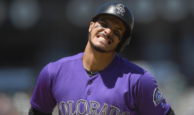 Nolan Arenado #28 of the Colorado Rockies reacts after striking out against the San Francisco Giant...