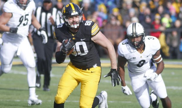 IOWA CITY, IA - NOVEMBER 21: Tight end Henry Krieger-Coble #80 of the Iowa Hawkeyes runs up the fie...