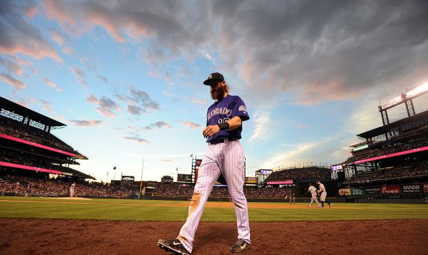 DENVER, CO - JULY 18:  Charlie Blackmon #19 of the Colorado Rockies walks off the field in the sixt...