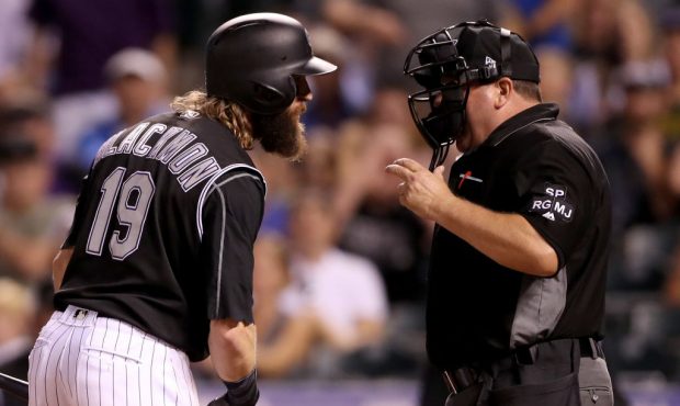 DENVER, CO - JULY 08:  Charlie Blackmon #19 of the Colorado Rockies argues with home plate umpire S...
