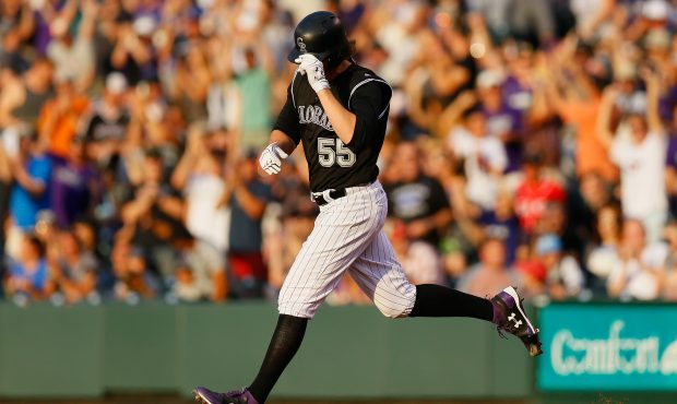DENVER, CO - JULY 5:  Jon Gray #55 of the Colorado Rockies tips his cap while trotting around the b...