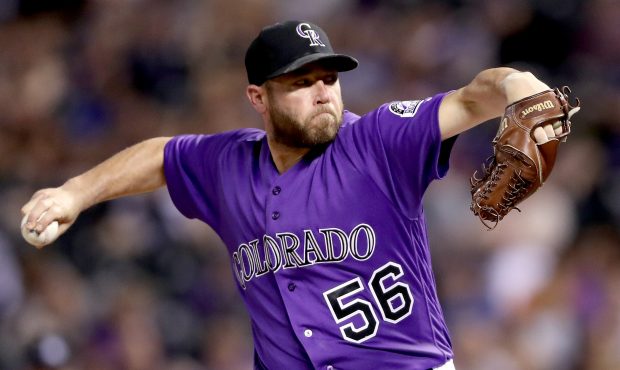 DENVER, CO - JULY 17:  Pitcher Greg Holland #56 of the Colorado Rockies throws in the ninth inning ...