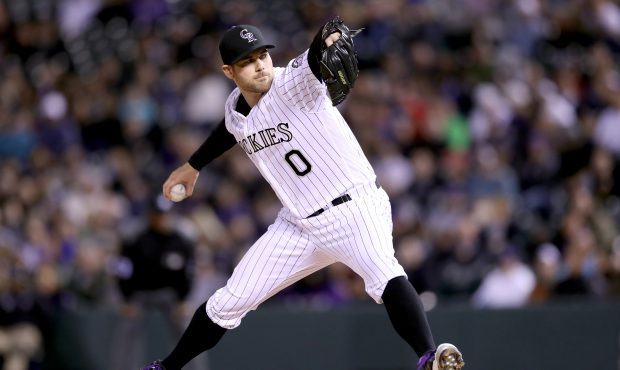 DENVER, CO - APRIL 11:  Pitcher Adam Ottavino #0 of the Colorado Rockies throws against the San Die...