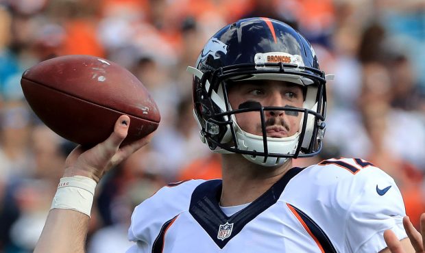 Paxton Lynch #12 of the Denver Broncos attempts a pass against the Jacksonville Jaguars at EverBank...
