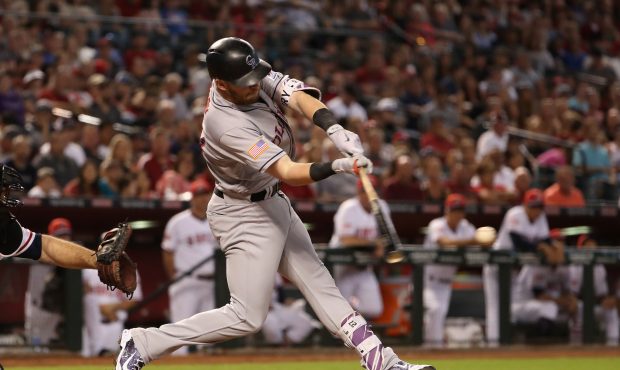 PHOENIX, AZ - JULY 02:  Trevor Story #27 of the Colorado Rockies hits a RBI single against the Ariz...