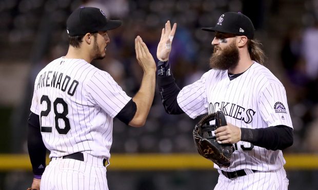 Nolan Arenado #28 and Charlie Blackmon #19 of the Colorado Rockies celebrate their win against the ...