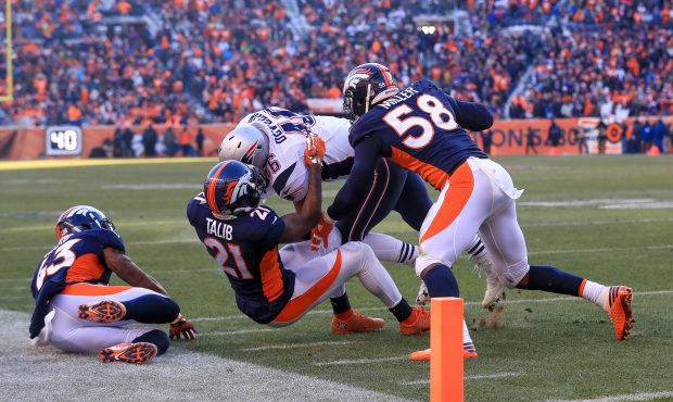 DENVER, CO - DECEMBER 18:  Fullback James Develin #46 of the New England Patriots is stopped short ...