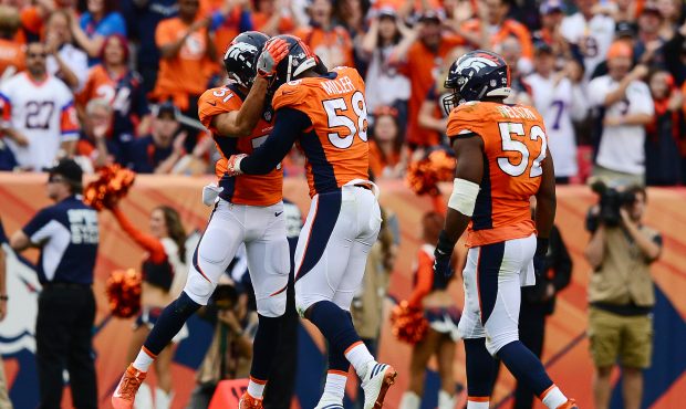 DENVER, CO - OCTOBER 30:  Free safety Justin Simmons #31 and outside linebacker Von Miller #58 of t...