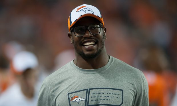 Outside linebacker Von Miller #58 of the Denver Broncos hangs out in the bench area in street cloth...