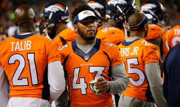 DENVER, CO - SEPTEMBER 03: T.J. Ward #43 of the Denver Broncos looks on from the bench against the ...