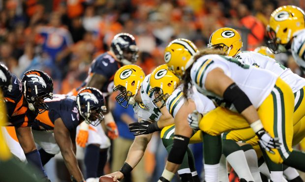 The Denver Broncos and the Green Bay Packers seen at the line of scrimmage during the second half a...