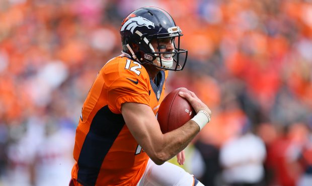 DENVER, CO - OCTOBER 9:  Quarterback Paxton Lynch #12 of the Denver Broncos runs with the ball duri...