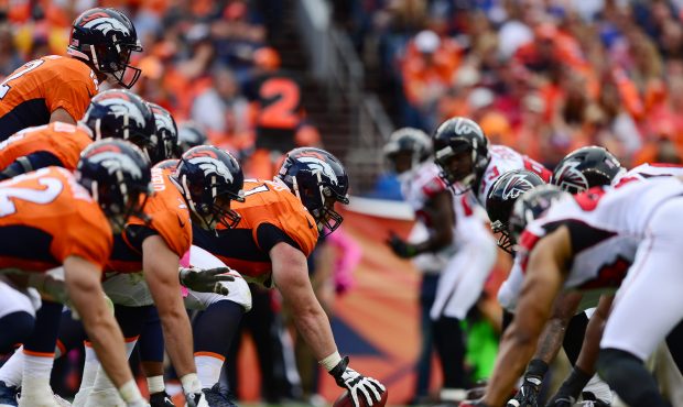 Center Matt Paradis #61 of the Denver Broncos prepares to hike the ball during the second half of t...