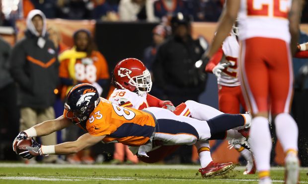 DENVER, CO - NOVEMBER 27:  Tight end A.J. Derby #83 of the Denver Broncos stretches for more yards ...