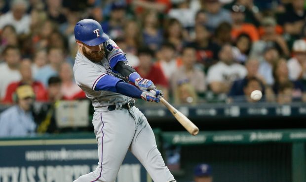 HOUSTON, TX - JUNE 12:  Jonathan Lucroy #25 of the Texas Rangers singles in the second inning again...