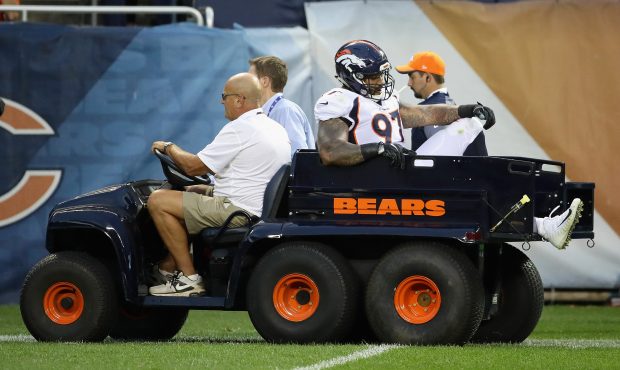 CHICAGO, IL - AUGUST 10: Billy Winn #97 of the Denver Broncos is carted off the field after sufferi...