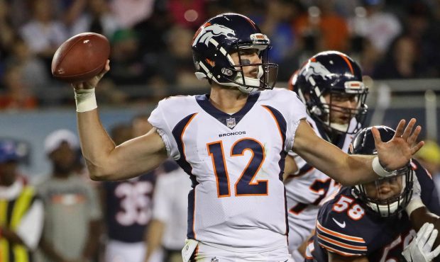 Paxton Lynch #12 of the Denver Broncos passes against the Chicago Bears during a preseason game at ...