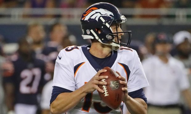 Trevor Siemian #13 of the Denver Broncos looks for a receiver against the Chicago Bears during a pr...