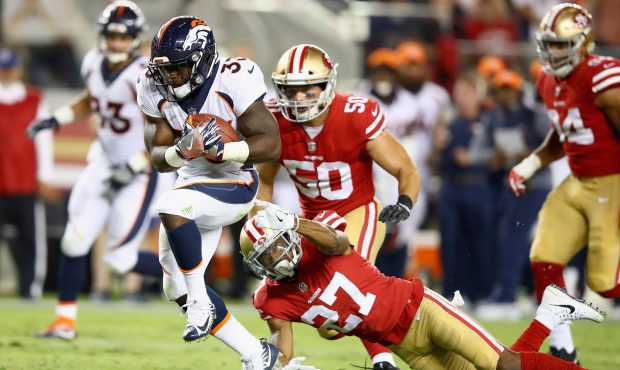 SANTA CLARA, CA - AUGUST 19:  De'Angelo Henderson #33 of the Denver Broncos tries to run away from ...
