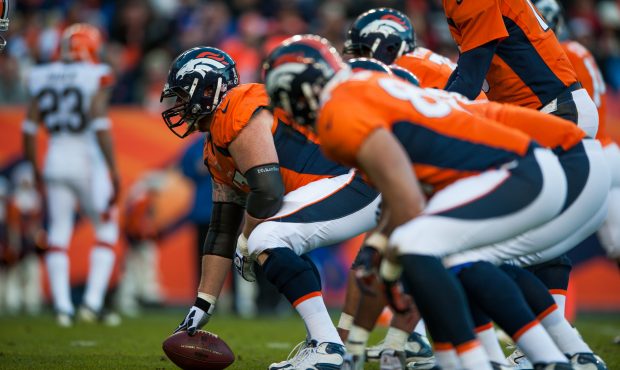 DENVER, CO - DECEMBER 23:  Center Dan Koppen #67 of the Denver Broncos lines up against the Clevela...