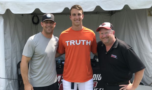 (From left) Brandon Stokley, Trevor Siemian, and DMac pose in front of the 104.3 The Fan tent at UC...