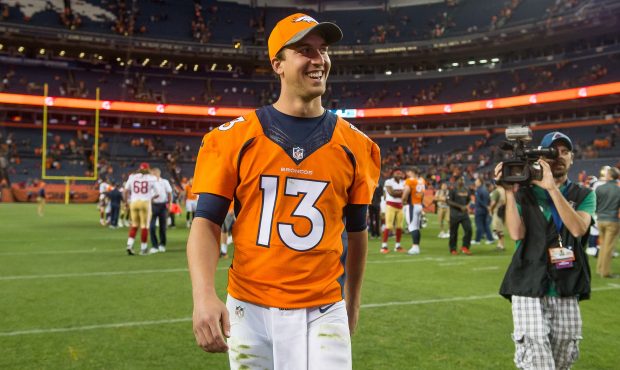 DENVER, CO - AUGUST 20:  Quarterback Trevor Siemian of the Denver Broncos walks off the field after...