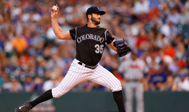 DENVER, CO - AUGUST 14:  Starting pitcher Chad Bettis #35 of the Colorado Rockies delivers to home ...