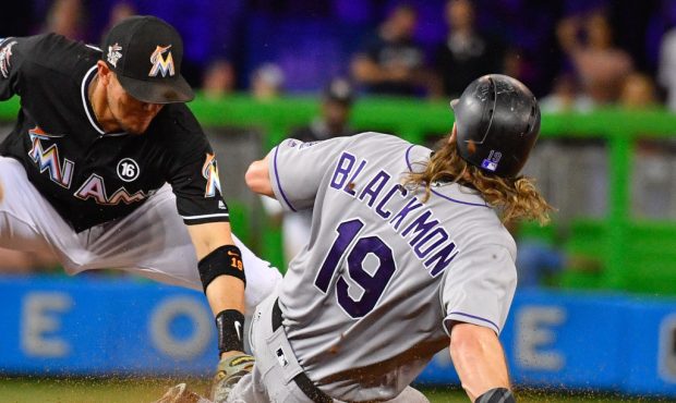 MIAMI, FL - AUGUST 12: Charlie Blackmon #19 of the Colorado Rockies is tagged out at second during ...