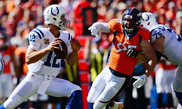 DENVER, CO - SEPTEMBER 18:  Quarterback Andrew Luck #12 of the Indianapolis Colts throws as defensi...
