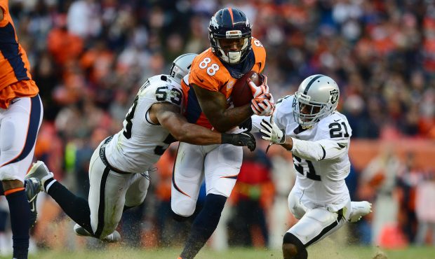 DENVER, CO - JANUARY 1:  Wide receiver Demaryius Thomas #88 of the Denver Broncos is tackled by cor...