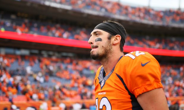 DENVER, CO - OCTOBER 9:  Quarterback Paxton Lynch #12 of the Denver Broncos walks off the field aft...