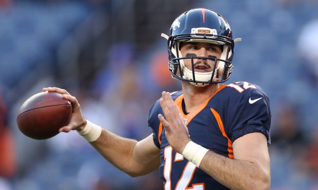 Quarterback Paxton Lynch #12 of the Denver Broncos warms up before the game against the Houston Tex...