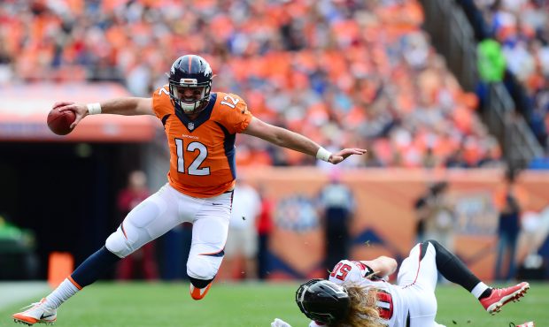 DENVER, CO - OCTOBER 9:  Quarterback Paxton Lynch #12 of the Denver Broncos evades linebacker A.J. ...