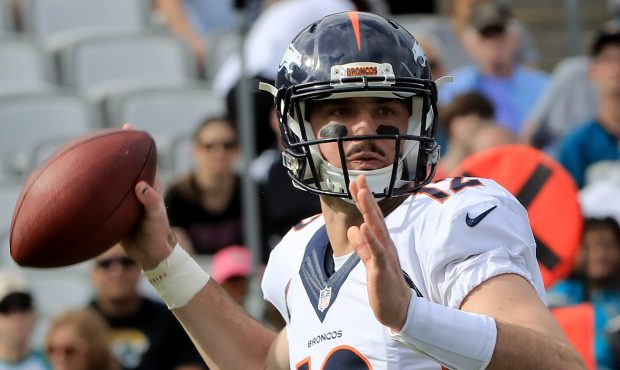 Paxton Lynch #12 of the Denver Broncos attempts a pass against the Jacksonville Jaguars at EverBank...
