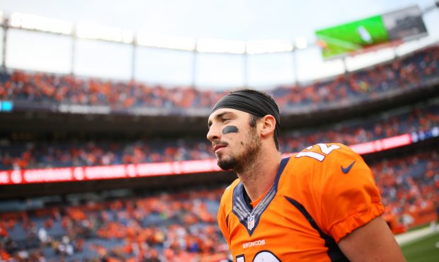 DENVER, CO - OCTOBER 9:  Quarterback Paxton Lynch #12 of the Denver Broncos walks off the field aft...