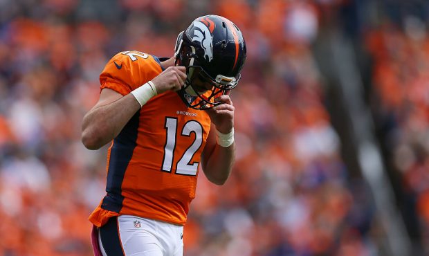 Quarterback Paxton Lynch #12 of the Denver Broncos walks off the field in the first half of the gam...