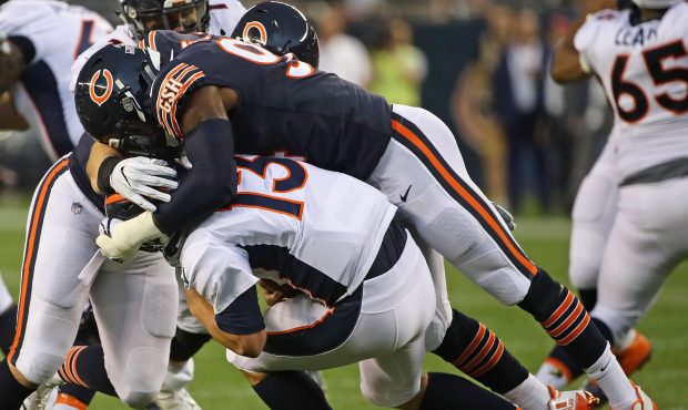 CHICAGO, IL - AUGUST 10:  Leonard Floyd #94 of the Chicago Bears sacks Trevor Siemian #13 of the De...
