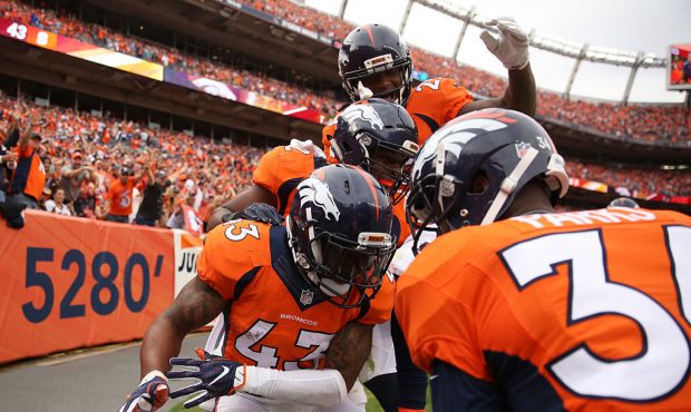 DENVER, CO - OCTOBER 30:  Strong safety T.J. Ward #43 of the Denver Broncos celebrates after interc...
