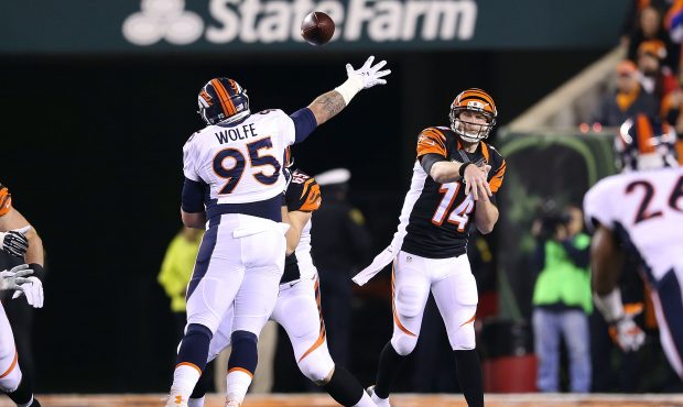 CINCINNATI, OH - DECEMBER 22:  Andy Dalton #14 of the Cincinnati Bengals throws a pass over Derek W...