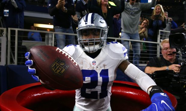 ARLINGTON, TX - DECEMBER 18:  Ezekiel Elliott #21 of the Dallas Cowboys celebrates after scoring a ...