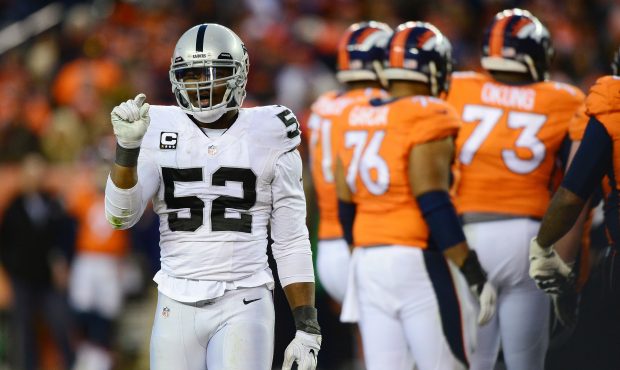 DENVER, CO - JANUARY 1:  Defensive end Khalil Mack #52 of the Oakland Raiders gestures in the fourt...