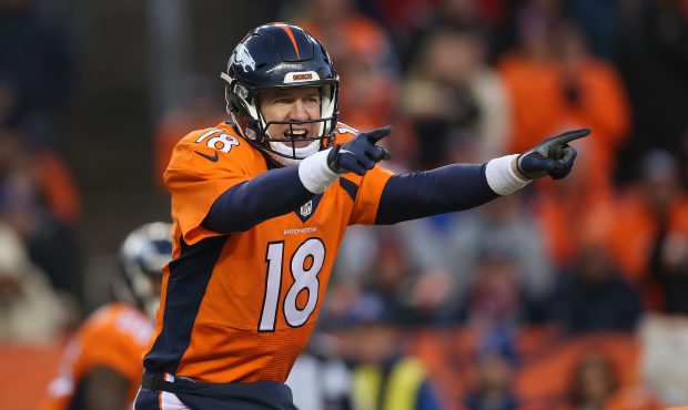 DENVER, CO - JANUARY 03:  Quarterback Peyton Manning #18 of the Denver Broncos runs the offense aga...