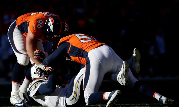DENVER, CO - JANUARY 12:  Philip Rivers #17 of the San Diego Chargers gets sacked by Jeremy Mincey ...